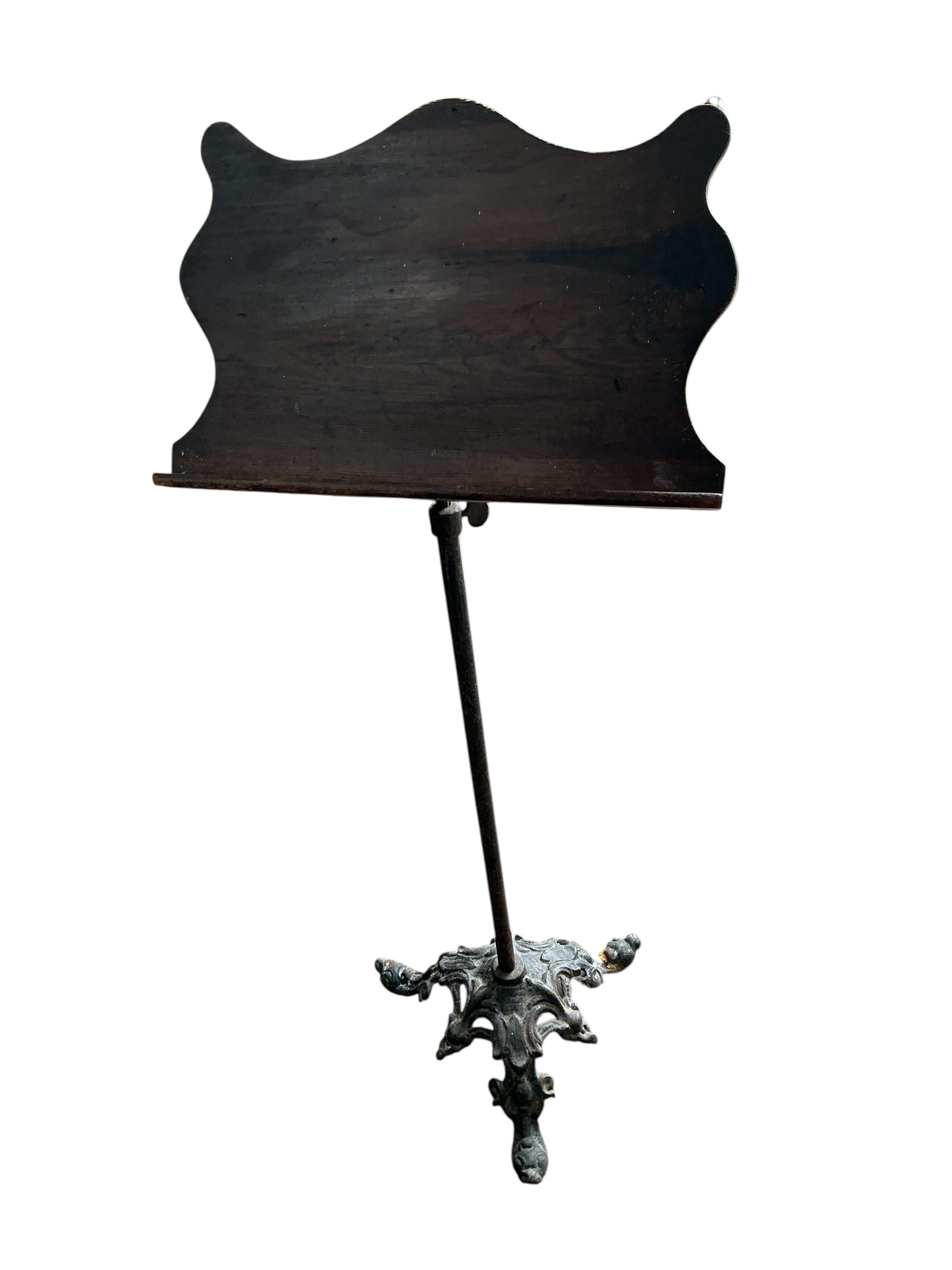 A pair of Victorian and later cast iron pine and mahogany music stands, height 112cm